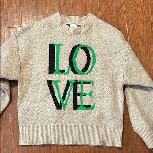A New Day tan Crewneck LOVE sweater with Green & Black Graphic, Medium